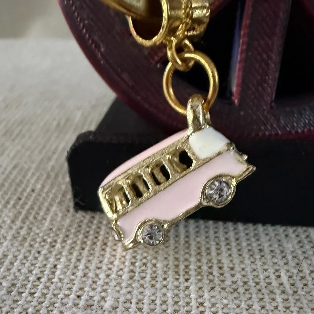 Gold Ring Keychain with Pink Bus Charm also peace sign keychain